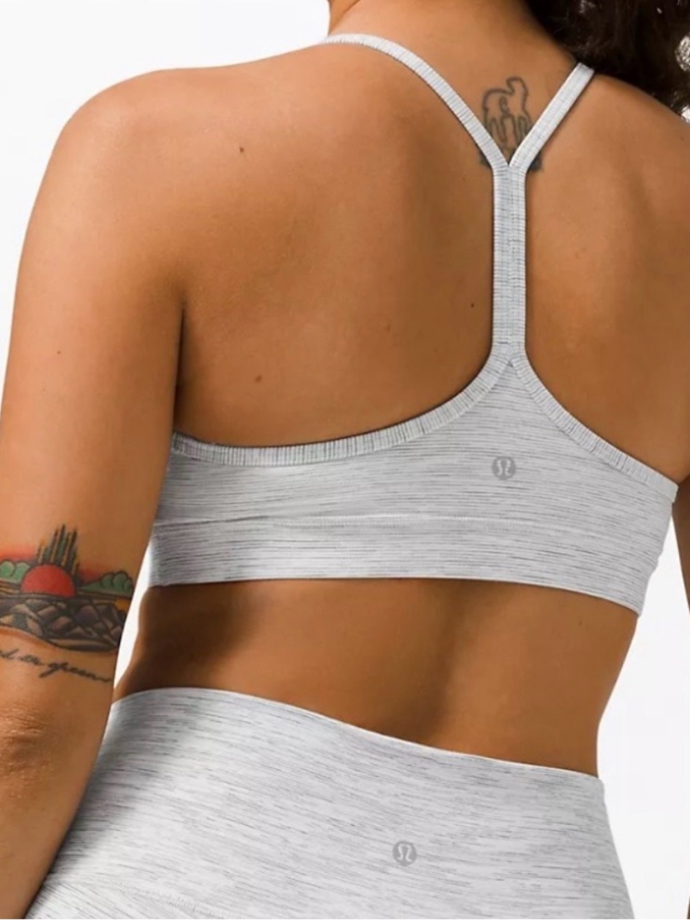 Gray and white Lululemon flow y sports bra
